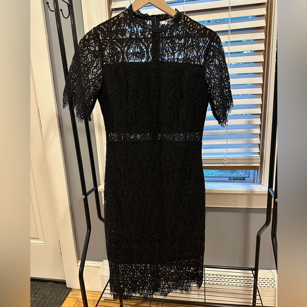 Lacy black dress with cut-outs